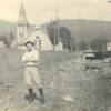 Work on Third Street drainage ditch at Magnolia Avenue before 1940 in South Pittsburg, Tennessee. This ditch was covered to open or widen Third Street to town. Old Methodist Episcopal Church in background. Courtesy, Gail Golliher